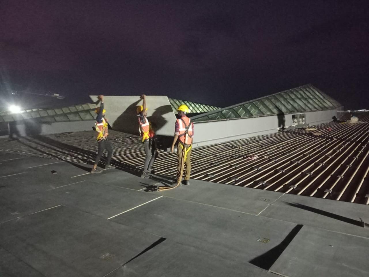 Architectural standing seam roofing for Lodha Mumbai: Premium metal building envelope featuring a minimalist aesthetic and hidden fastener technology by Rishonn & Reyansh.